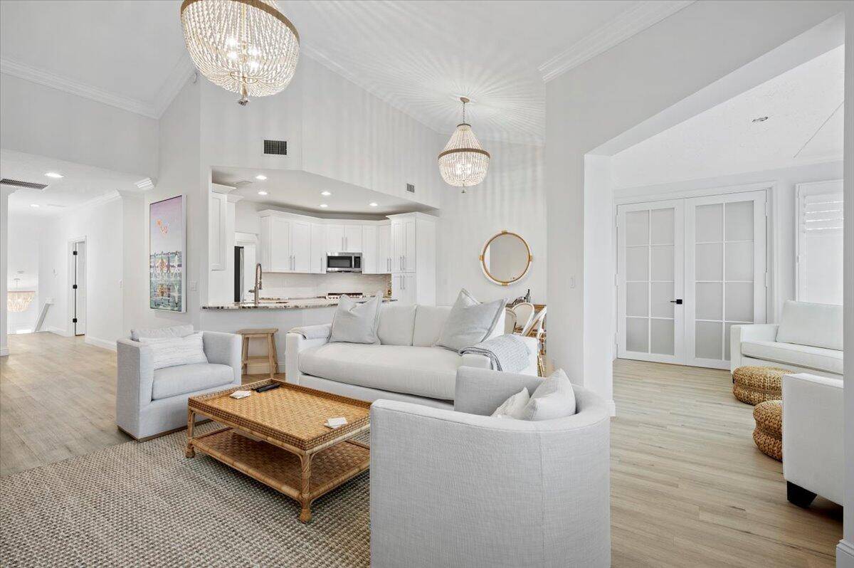 WELCOME TO JUNO BEACH ! Sit back and RELAX as you enter this NEWLY RENOVATED unit with STUNNING LAKE VIEWS from almost EVERY ROOM just STEPS TO THE BEACH.