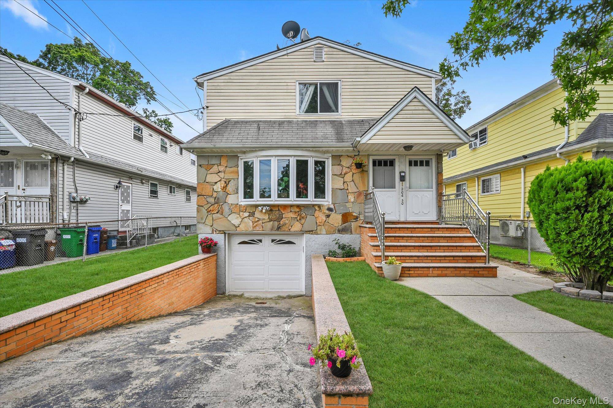 Welcome to this charming detached legal 2 family in the heart of Bayside !