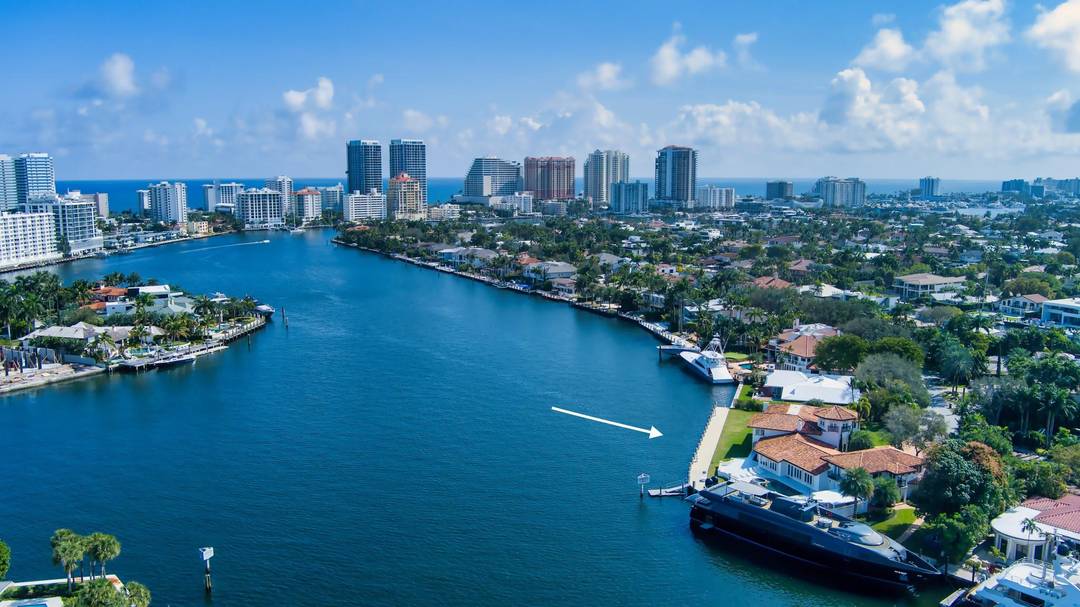 Perched on a prestigious point lot in the exclusive Seven Isles community, this waterfront sanctuary offers an unrivaled South Florida lifestyle.