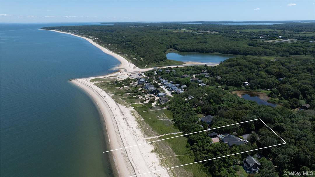 This stunning Peconic sound front property, perched elegantly on a hill with breathtaking views of the sound, has been recently updated with a new roof and siding.
