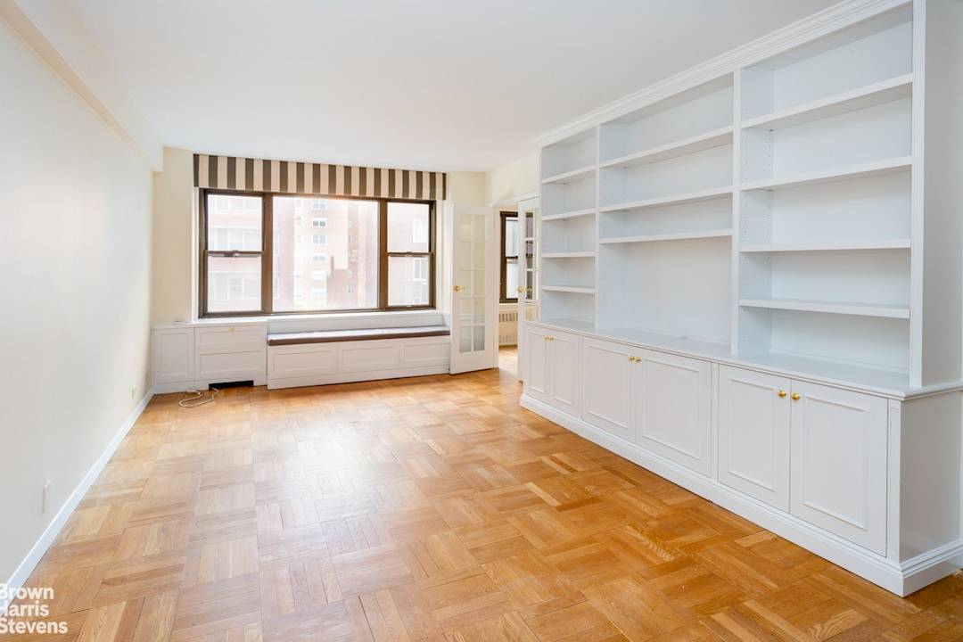 Very gracious one bedroom with large living room complete with custom bookcases, and separate dining room easily made into a small bedroom or office.