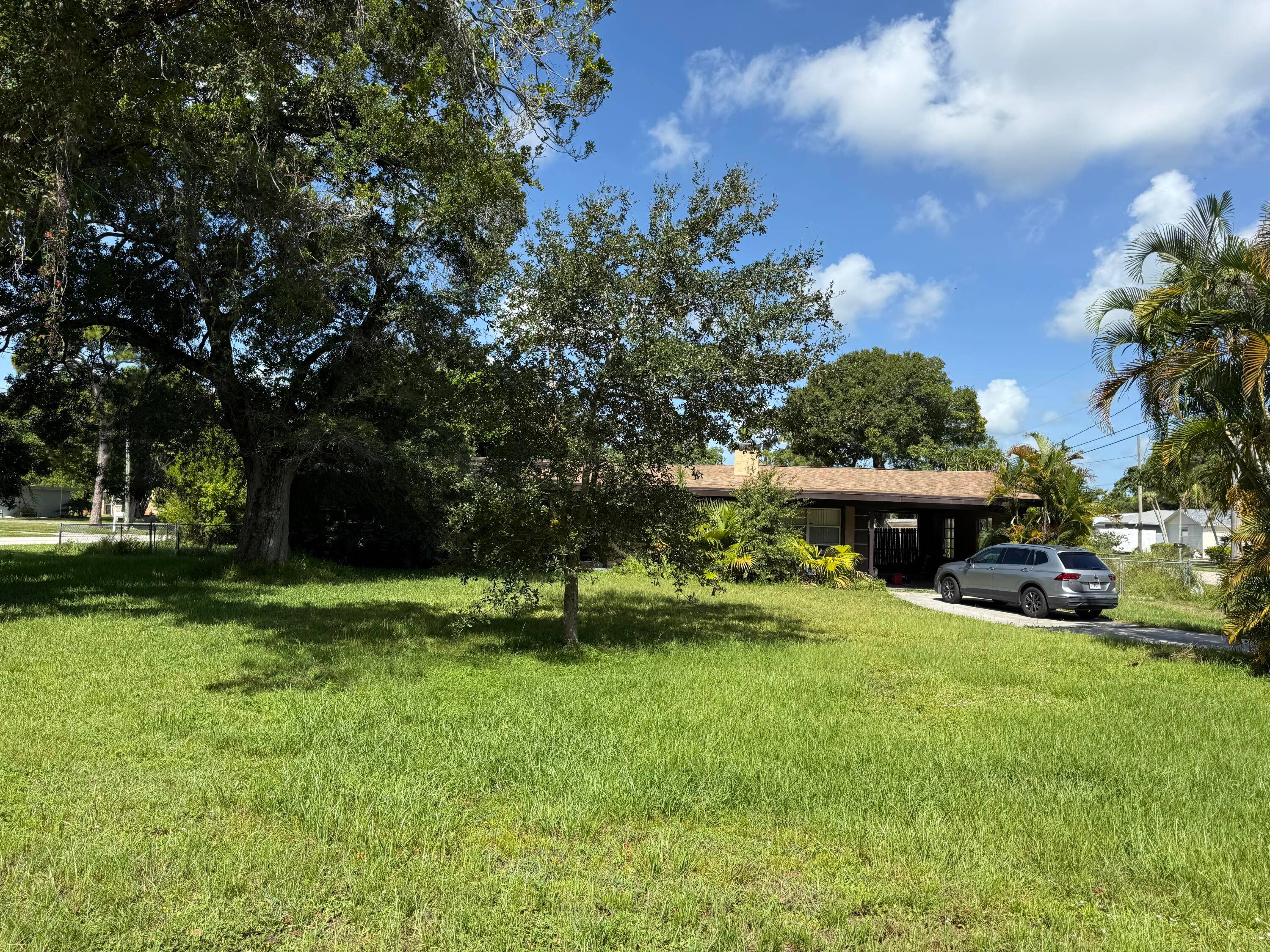 This Centrally located Fort Pierce Home sits on larger corner lot minutes to Downtown Fort Pierce and Beach.