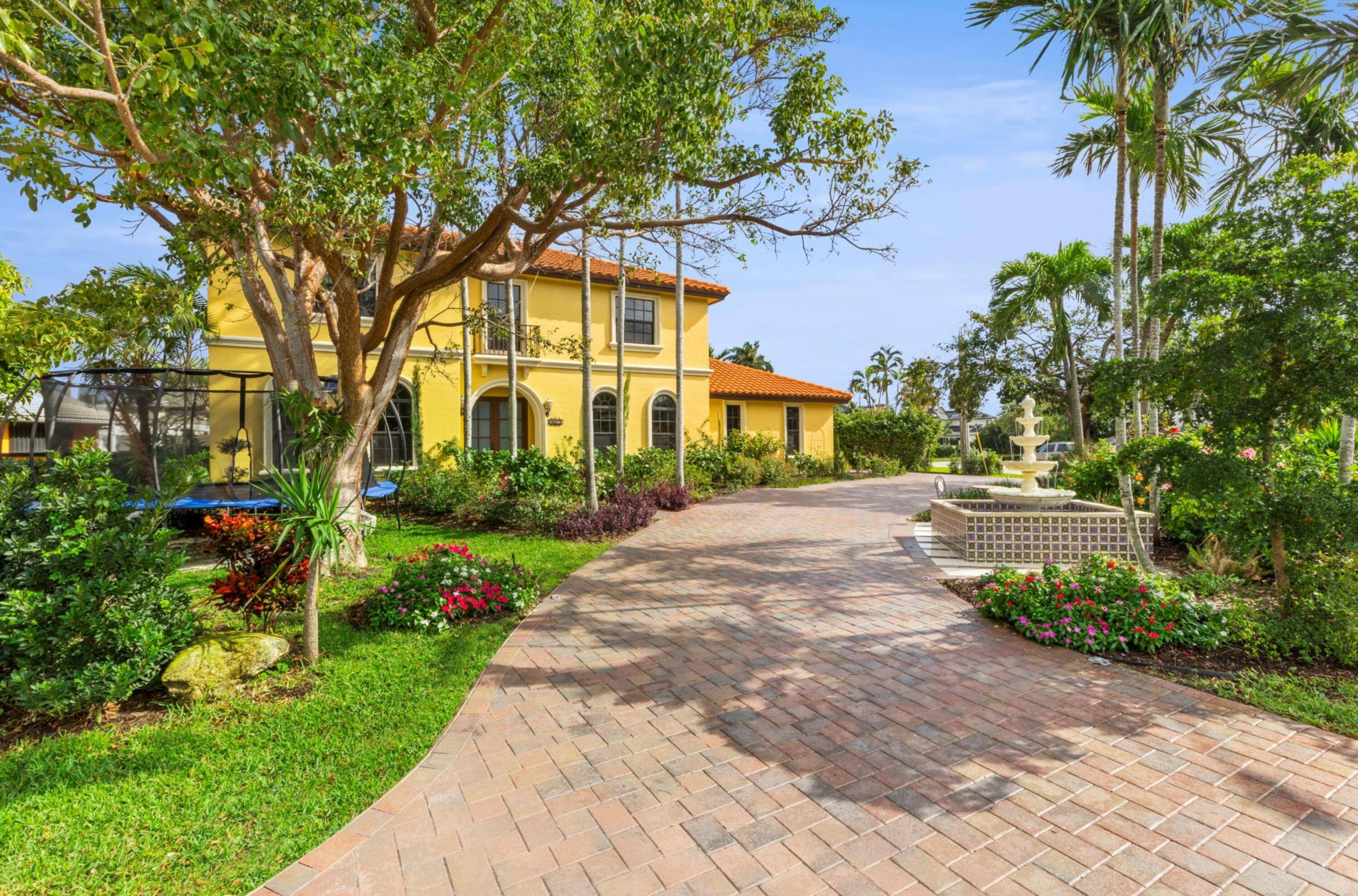 Elegant updated residence, with a spectacular outdoor entertaining backyard, features 50 feet of waterfrontage and a dock along the end of the Abaco canal that connects to the Intracoastal.