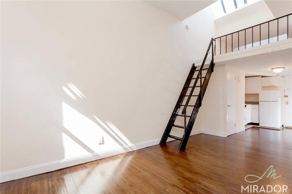 Big, bright amp ; sunny loft style studio with large stand up sleep loft with sky light in Union Square elevator building.