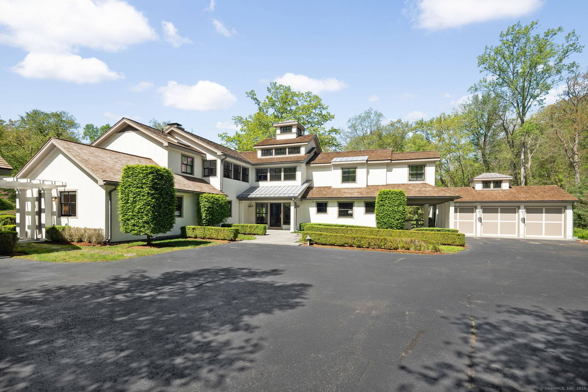 California meets New Canaan in this William Wurster inspired transitional style masterpiece set on 2.