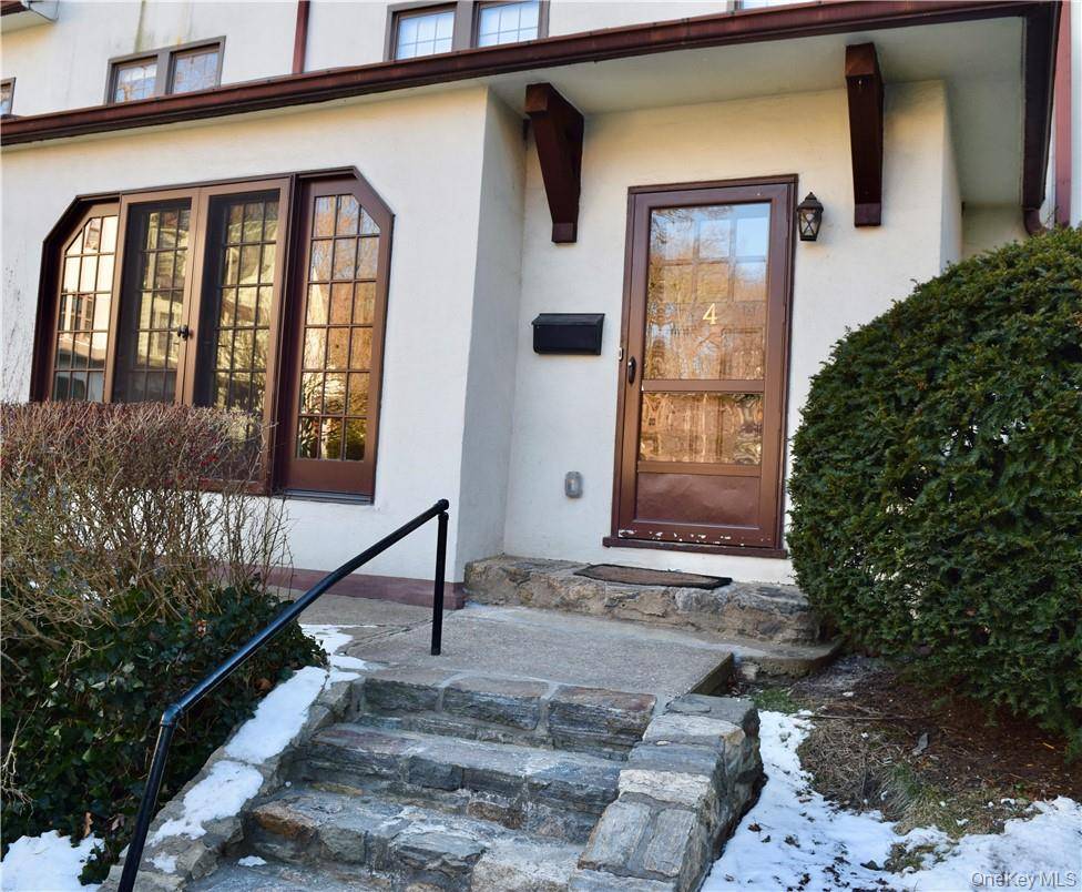 Prescott Square is a charming collection of Tudor townhouses tucked down a private lane from Sagamore Road.