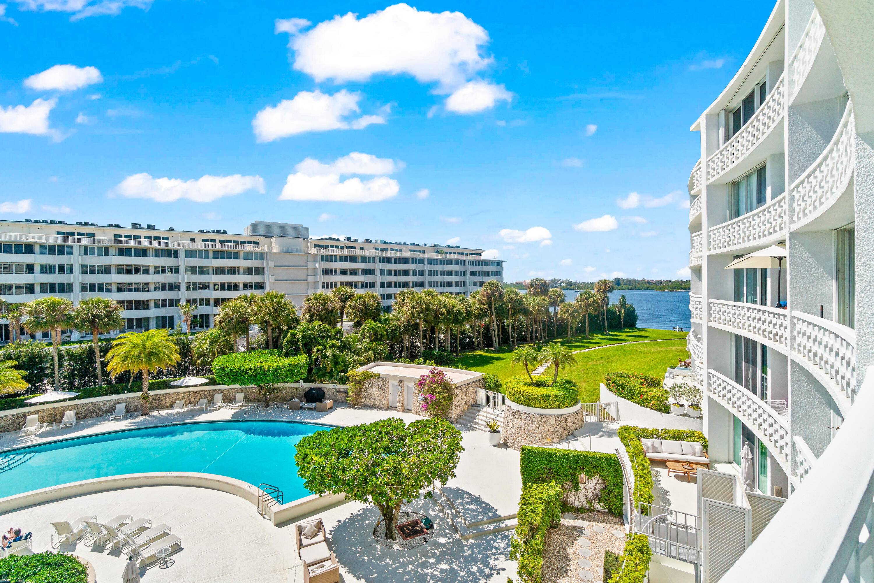 This sun filled tastefully renovated apartment features large white tile floors, a stylish kitchen, and a modern bath in elegant neutral tones.