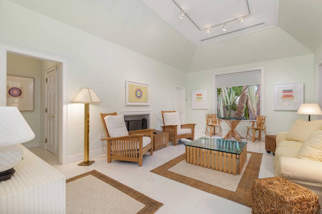 Tucked away in the heart of Palm Beach, this quintessential island bungalow is a rare jewelbox, offering privacy, charm, and effortless indoor outdoor living.