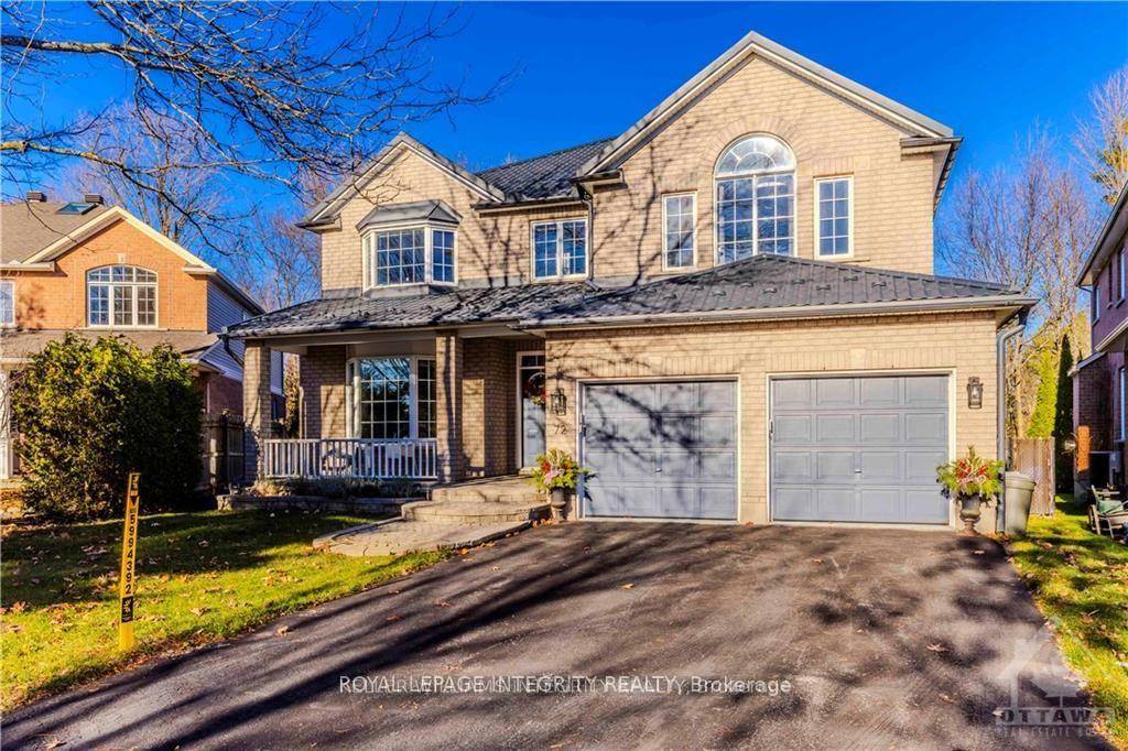 Rarely offered ! This expansive home backs onto woods and a golf course, offering privacy and stunning views.
