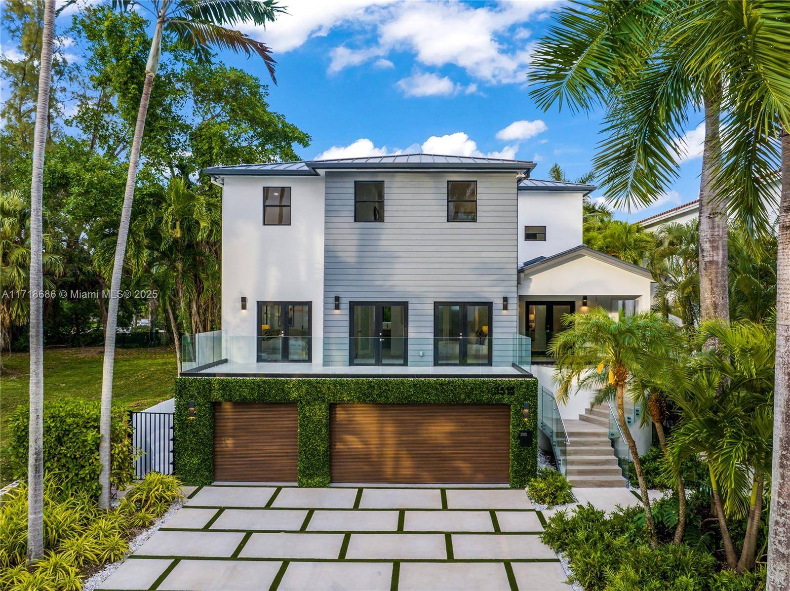 Stunning traditional modern 6 bed 7 bath 3 story home in highly desirable Northeast Coconut Grove.