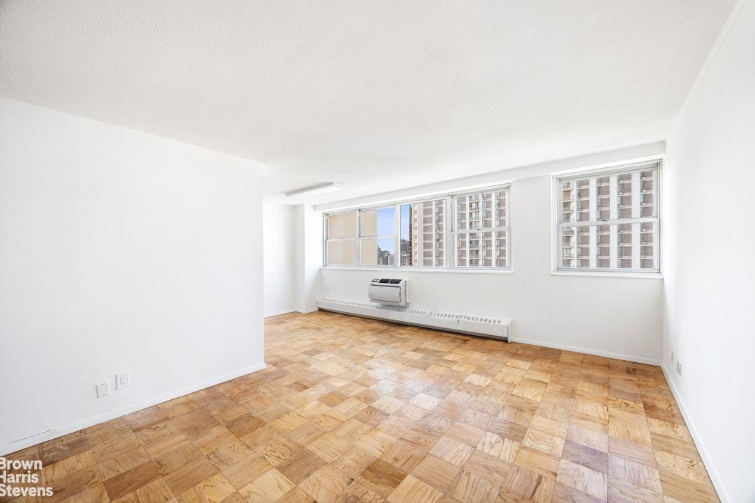 Excellent opportunity to purchase a spacious alcove studio with great light from a wall of south facing windows with river views.