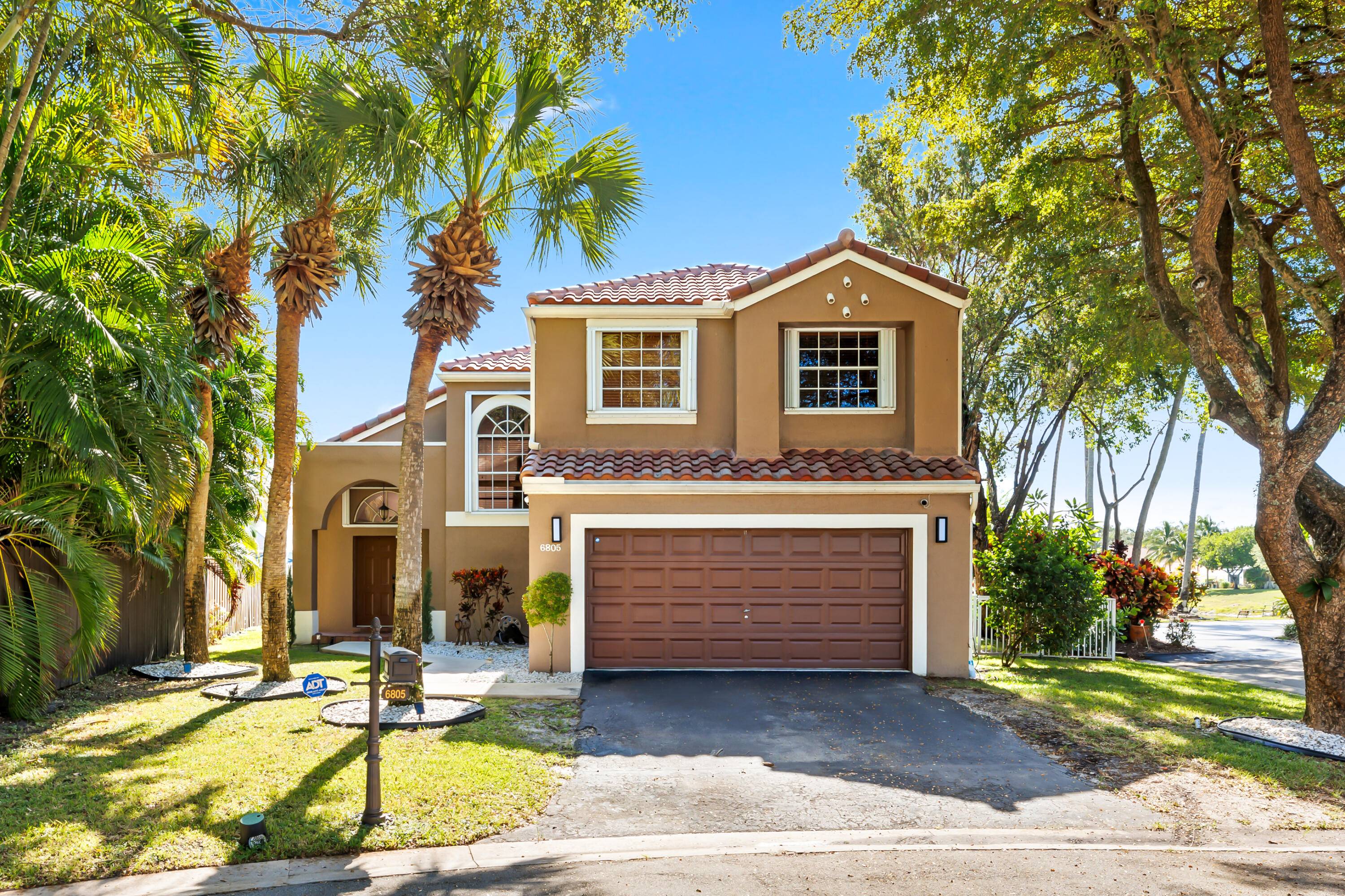 Tucked at the end of a quiet cul de sac in one of Parkland's most desirable gated communities, this 4 bedroom, 2.