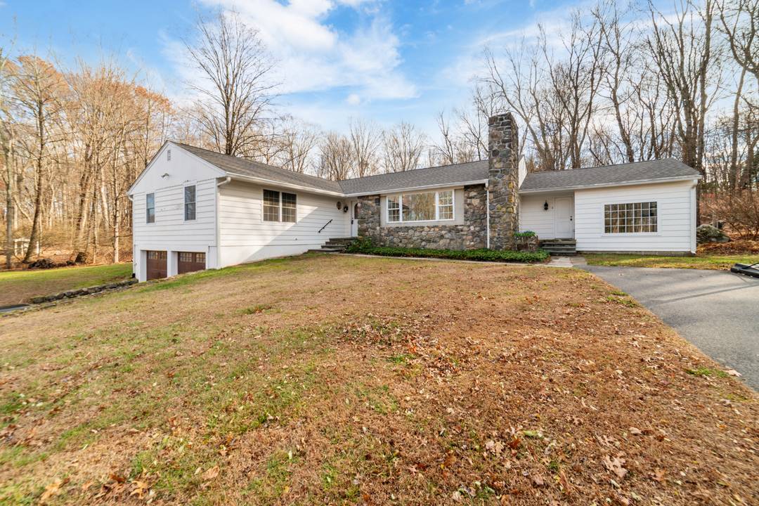 Lovingly updated Mid Century Ranch on a private, level 1.