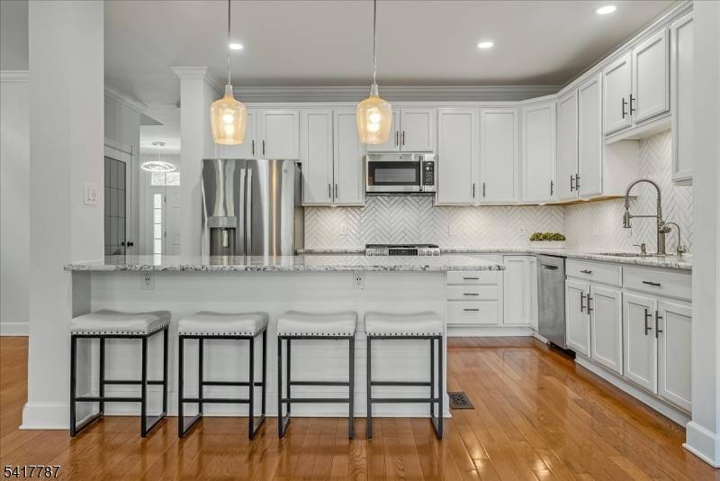 Experience the ultimate in urban luxury with this end unit townhome, perfectly situated minutes from downtown Morristown.