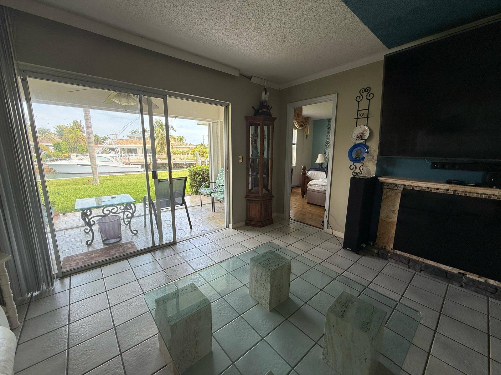 Experience contemporary coastal living in this exquisite first floor waterfront 2 bedroom, 2 bath condo with unparalleled skyline views overlooking the Waterway and Sugar Sands Marina.