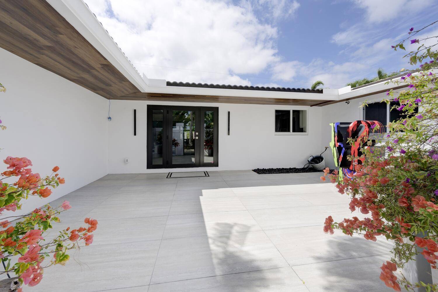 Completely reimagined from the slab up, this modern masterpiece in Boca Raton's coveted Golden Triangle blends designer sophistication with pure Florida lifestyle.