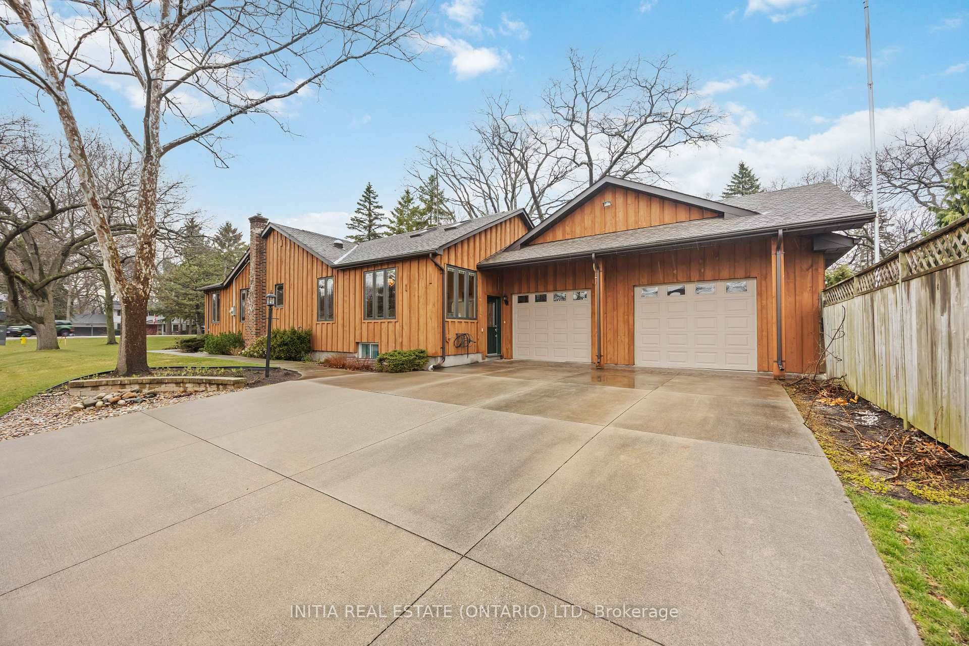 Live on prestigious Lakeshore Road in this charming, unique 3 bed, 2 bath impeccably cared for bungalow on a large corner lot, just steps from the beach, parks, trails, shopping ...