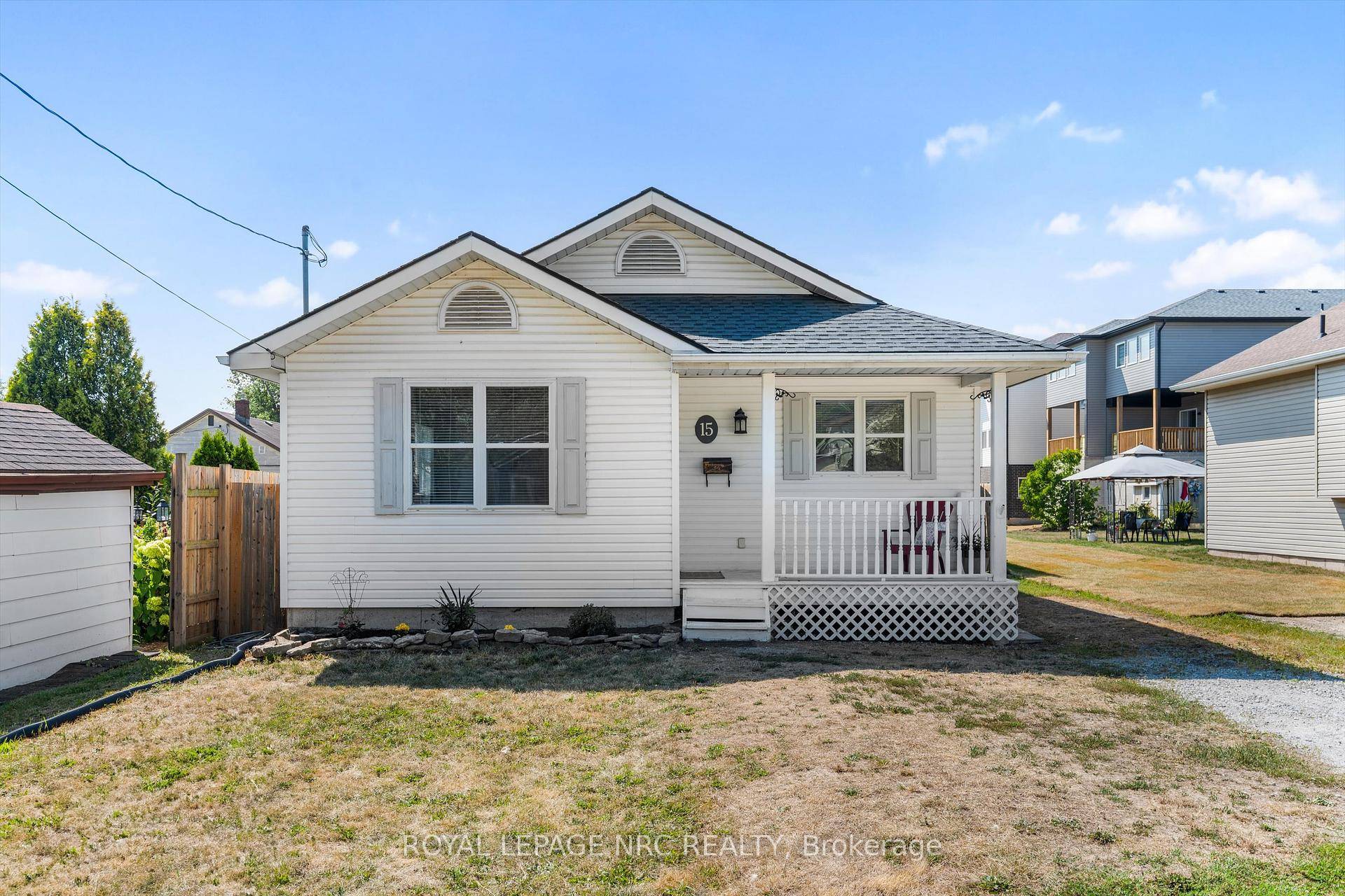 Surprisingly Spacious ! An unassuming but attractive white bungalow on a quiet street in the peaceful Hamlet of Dain City.