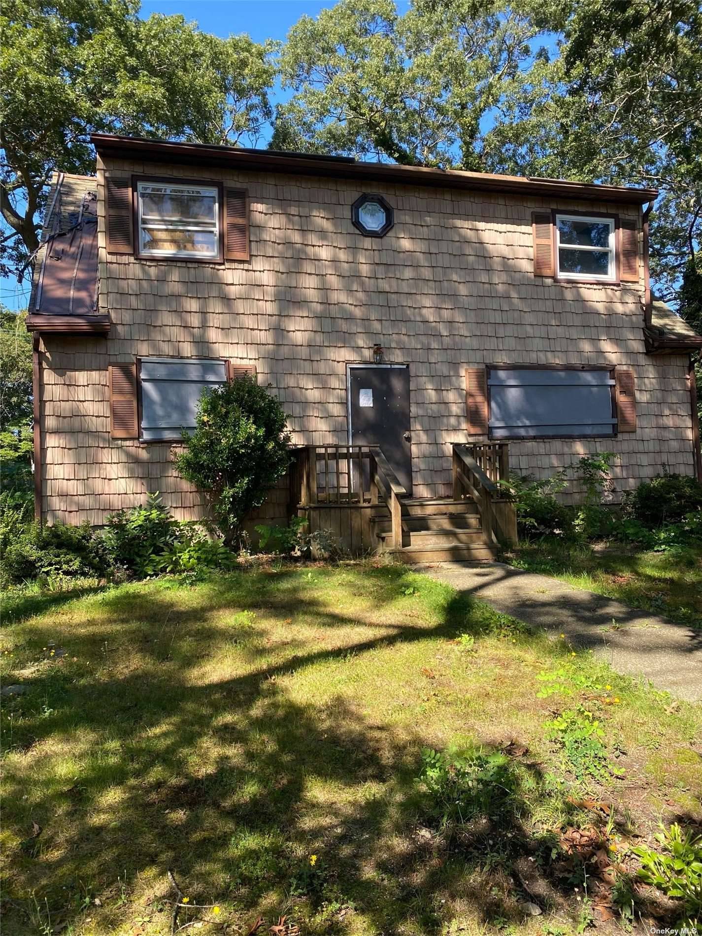 THIS LARGE COLONIAL HOUSE POSSESSES IMMENSE POTENTIAL AWAITING A KEEN EYE AND SKILLED HANDS TO RESTORE IT TO ITS FORMER GLORY !