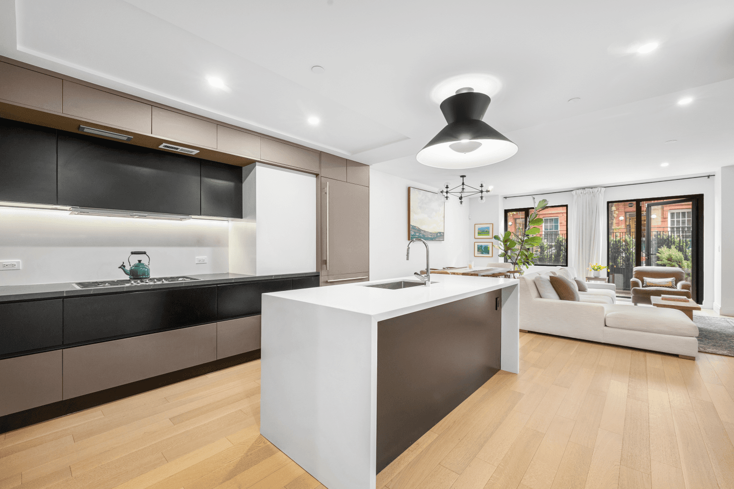 Welcome to Unit 1 at 318 East 81st Street a refined, garden level duplex that seamlessly blends the elegance of Upper East Side living with the openness of modern design.