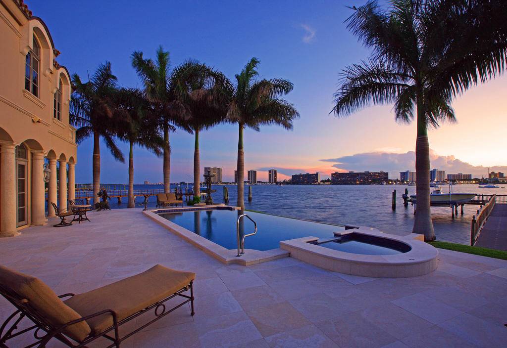 This custom built quality home is on a half acre point lot with spectacular wraparound water views !