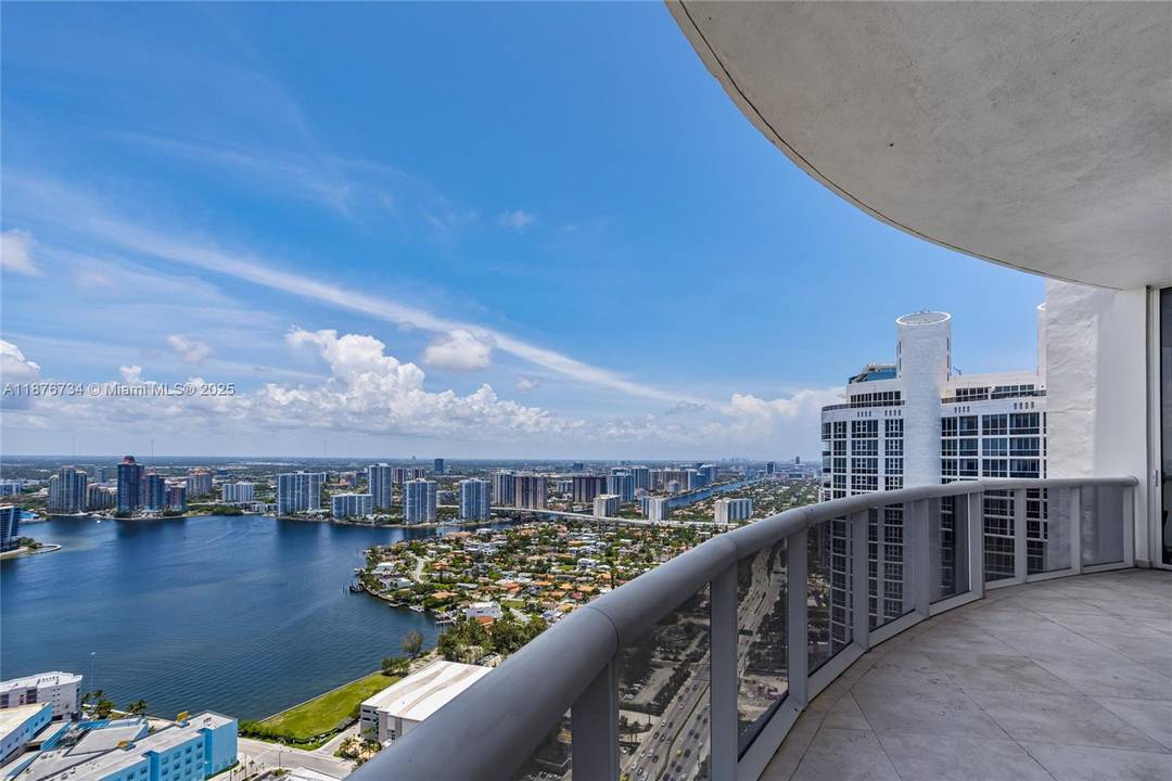 Experience elevated coastal living in this extraordinary PENTHOUSE boasting 3 bedrooms, 3.
