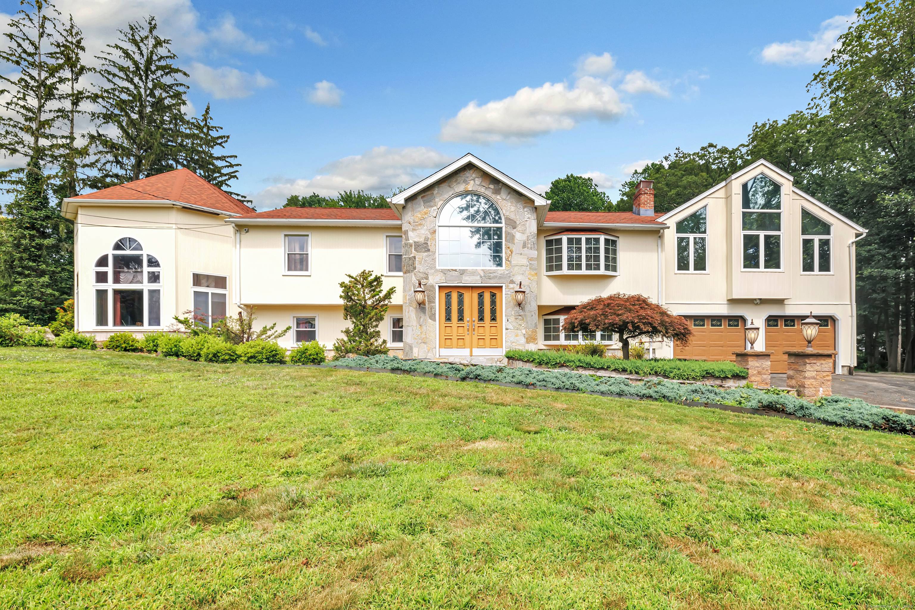 Welcome to this magnificent custom built raised ranch known as 40 Walnut Street located in Fairfield County in the Town of Monroe.