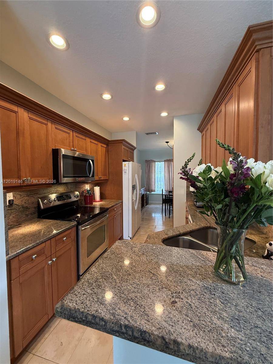 Welcome to this beautifully maintained townhome located in the highly sought after community of Pembroke Isles.