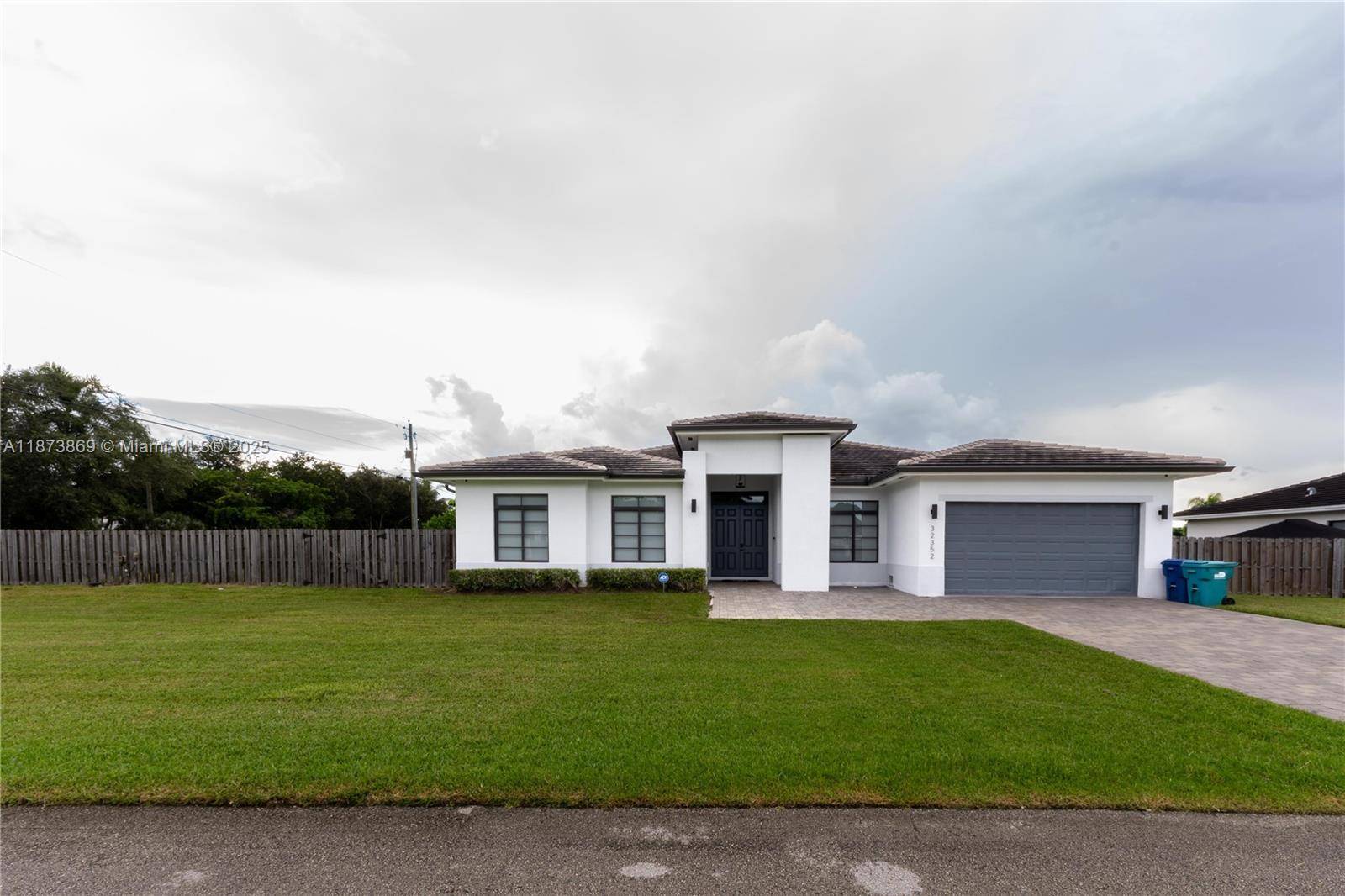 Home built in 2020 featuring many upgrades like porcelain tiles, impact windows, quartz counter tops, oversized bedroom doors, separate soaking tub, impact sliding glass door with electric shades, beautiful designer ...