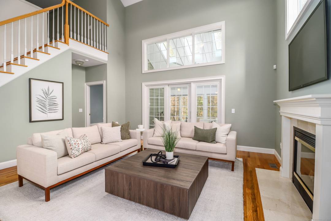 Experience the best of main level living in this beautifully refreshed townhome in sought after Newbury Village, Brookfield's premier 55 community.