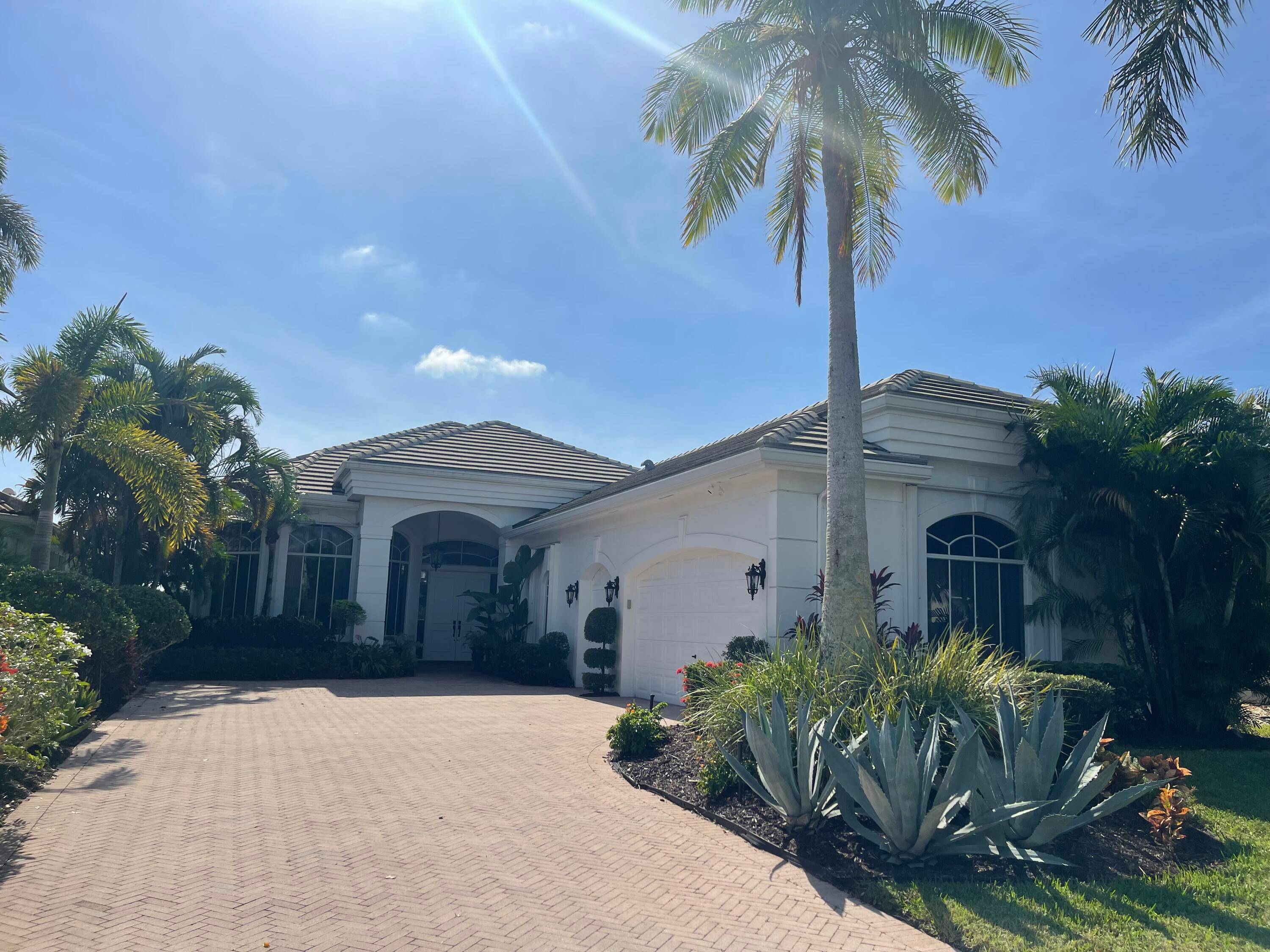 Mediterranean style home features 3BR 4FB, along with screened in lanai pool and picturesque golf course views.