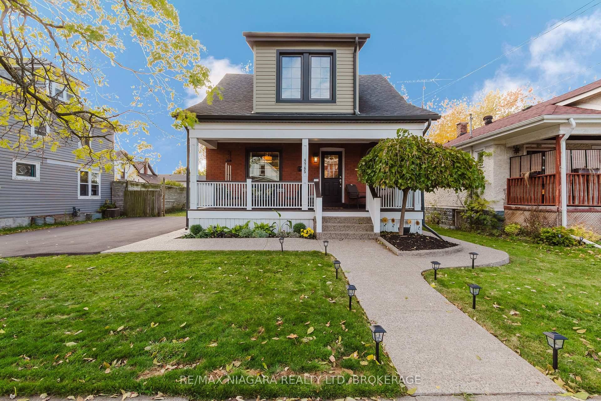 Beautifully Updated 2 Storey Home with In Law Suite and Double Lot !