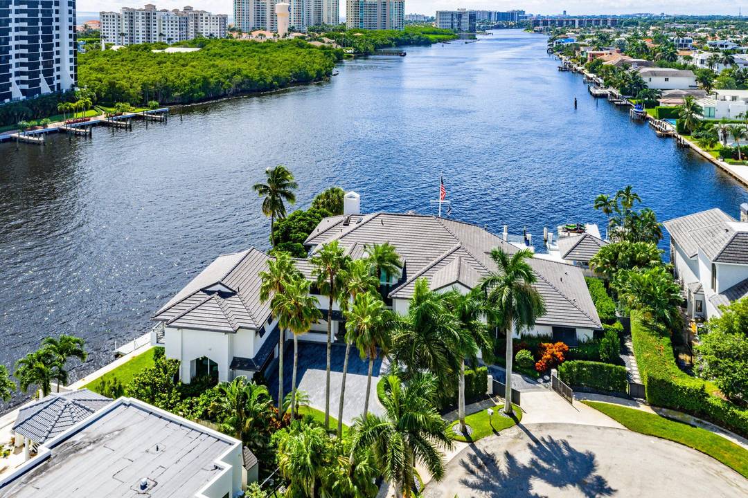 A true point lot on the Intracoastal, 7400 NE Orchid Bay Terrace commands more than 270 feet of wraparound waterfront with direct ocean access and quick run to the inlet.