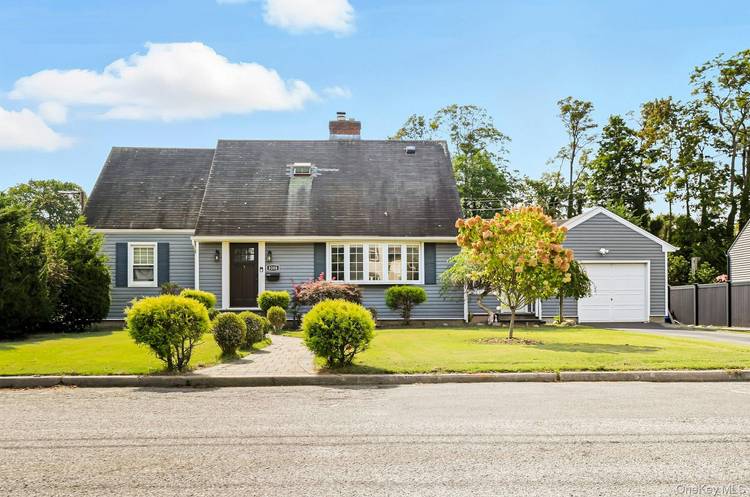 Welcome home to this Expanded Cape Cod in Wantagh !