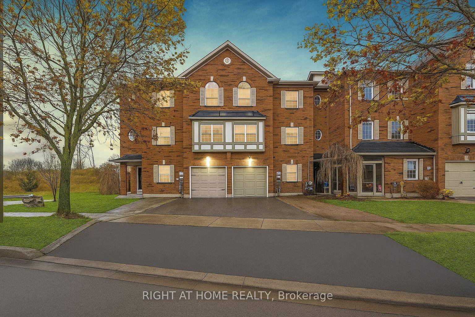 Stunning 3 Bedroom End Unit Townhome Backing Onto Green Space in Sought After Aurora Grove.