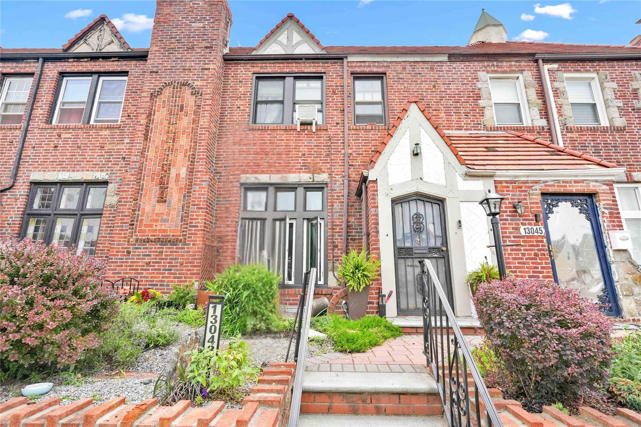 This beautiful Tudor style townhouse comes with first floor features a bright sunken living room with working fireplace and decor expose beam and orginal detailing, formal dining room open concept ...