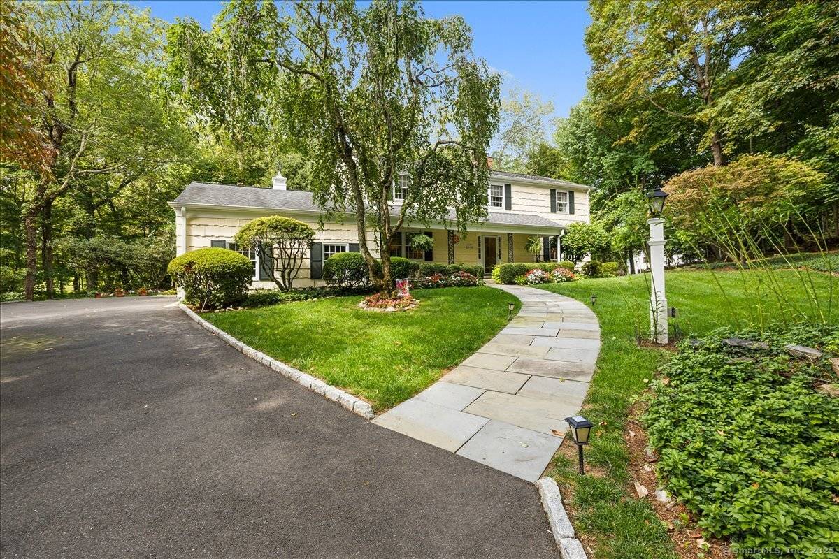 Situated on a quiet cul de sac, this classic center hall Colonial has it all !