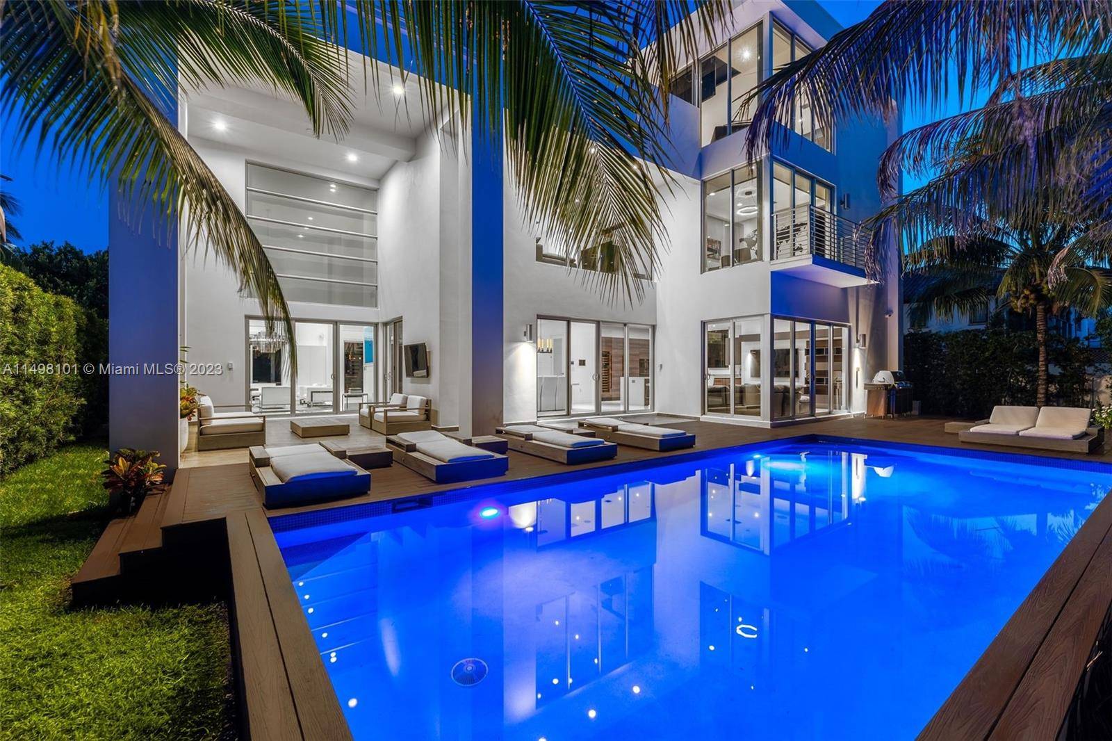 Welcome to this sleek three story smart home, just a block from the ocean.