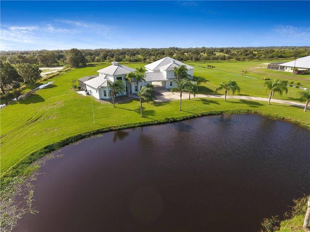 Key West style on 5 Acres Overlooking a stocked pond lake.