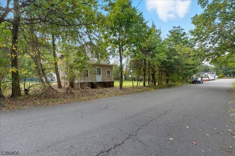 Welcome to this rare renovation opportunity on a spacious corner lot just minutes from Rutgers University's College Avenue Campus.