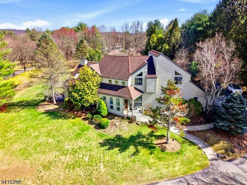 Set behind a long, private approach and surrounded by mature trees, this 4 bedroom, 4 bath residence offers a rare sense of seclusion, space, and light in one of Boonton ...