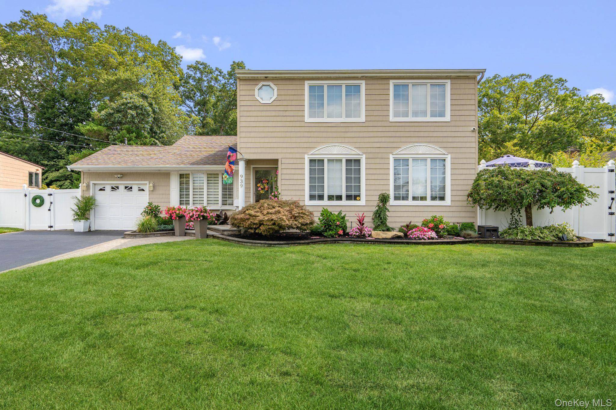 Welcome home to 939 Manor Lane in Bay Shore.