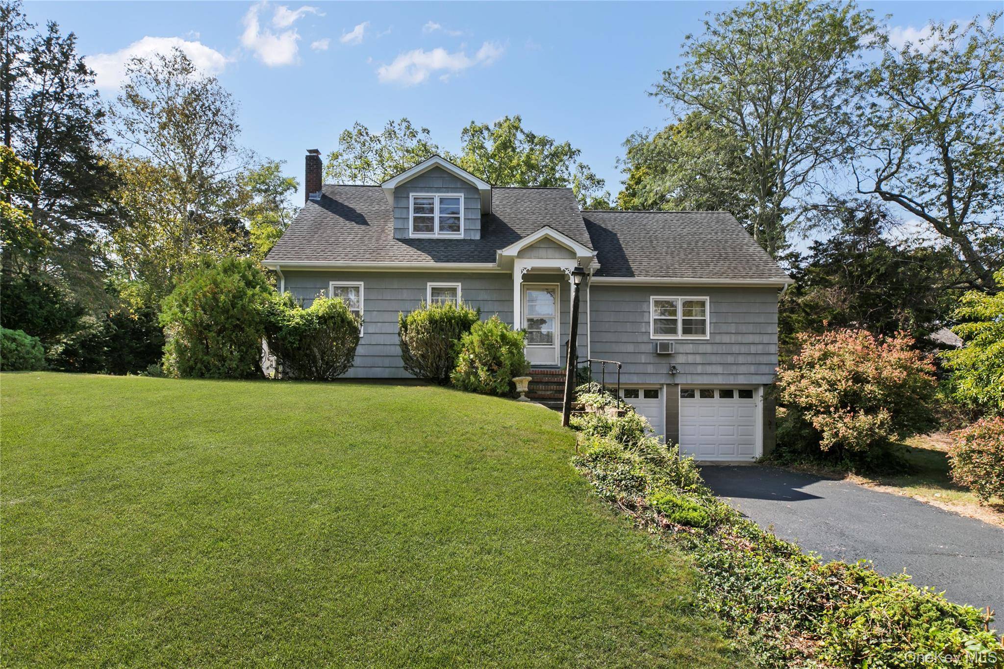 Classic 1950s Four Bedroom, Two Bath Home This well kept vintage residence offers light filled rooms, hardwood floors, and a practical four bedroom, two bath layout.