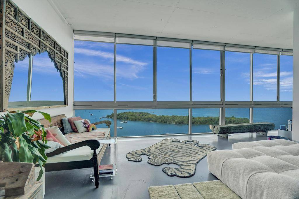 Step into the extraordinary Unit 1205 at Space 01 isn't just a home, it's an experience perched high above the water in iconic North Bay Village.
