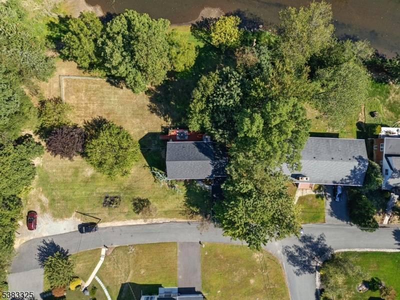 Welcome to 232 Riverside Drive West in Denville, a spacious and inviting Colonial that blends comfort, functionality, and modern updates.