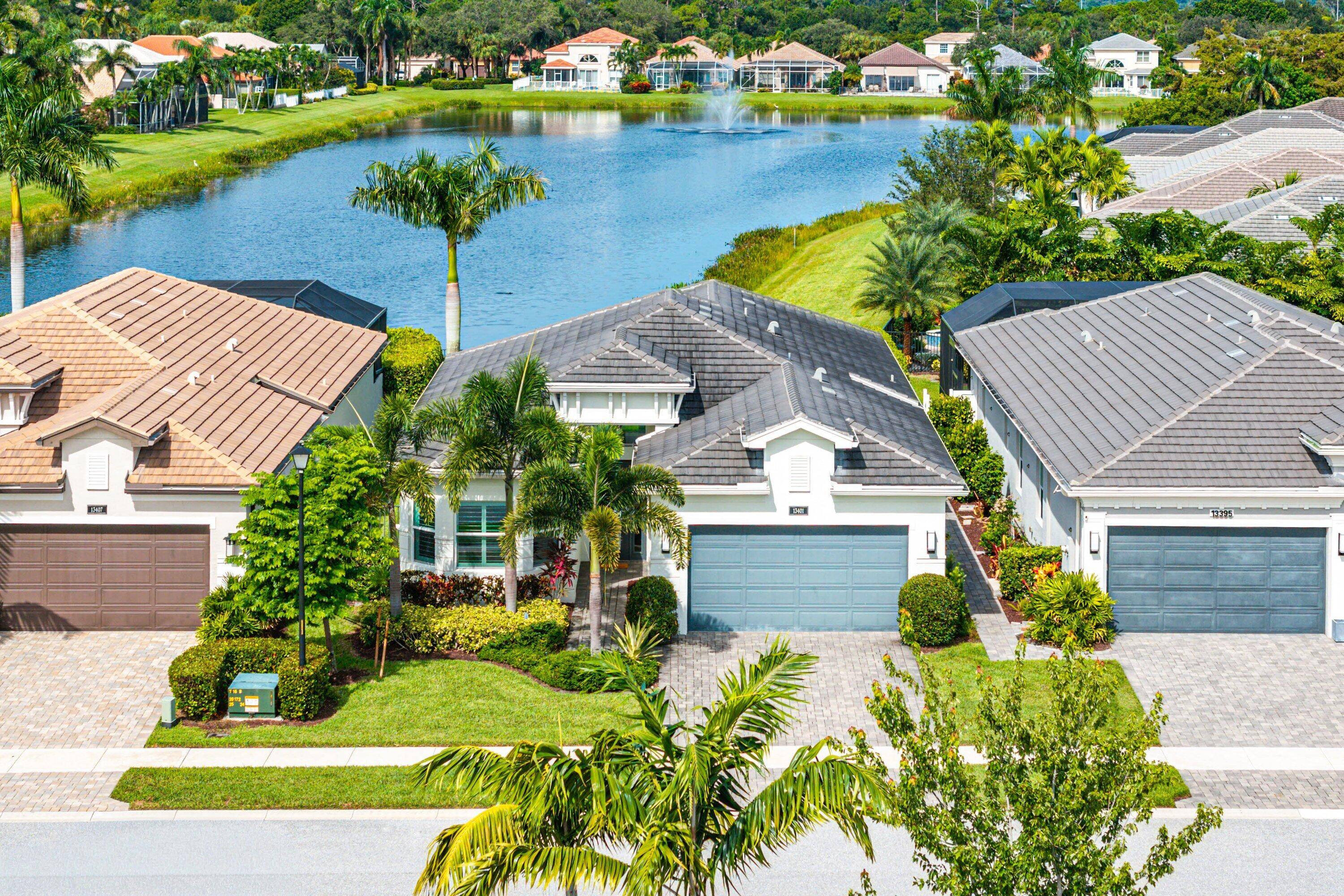 Enjoy resort style living in this chic one story home with exquisite long lake views in Polo Trace !