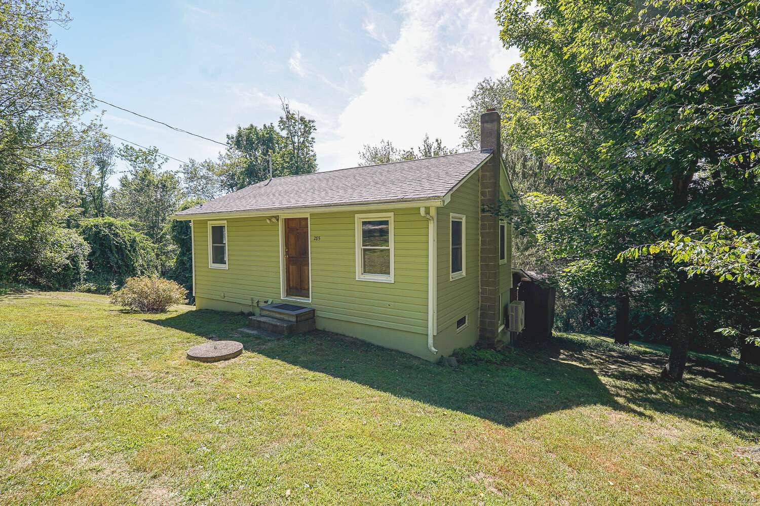 Discover the charm of lakeside living on peaceful Quasset Lake in Woodstock, CT.