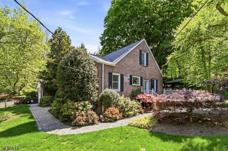 Comfort, convenience and tranquility abound in this beautiful Cape Cod style home offering an ideal balance of retreat and accessibility, and set on a picturesque corner property !
