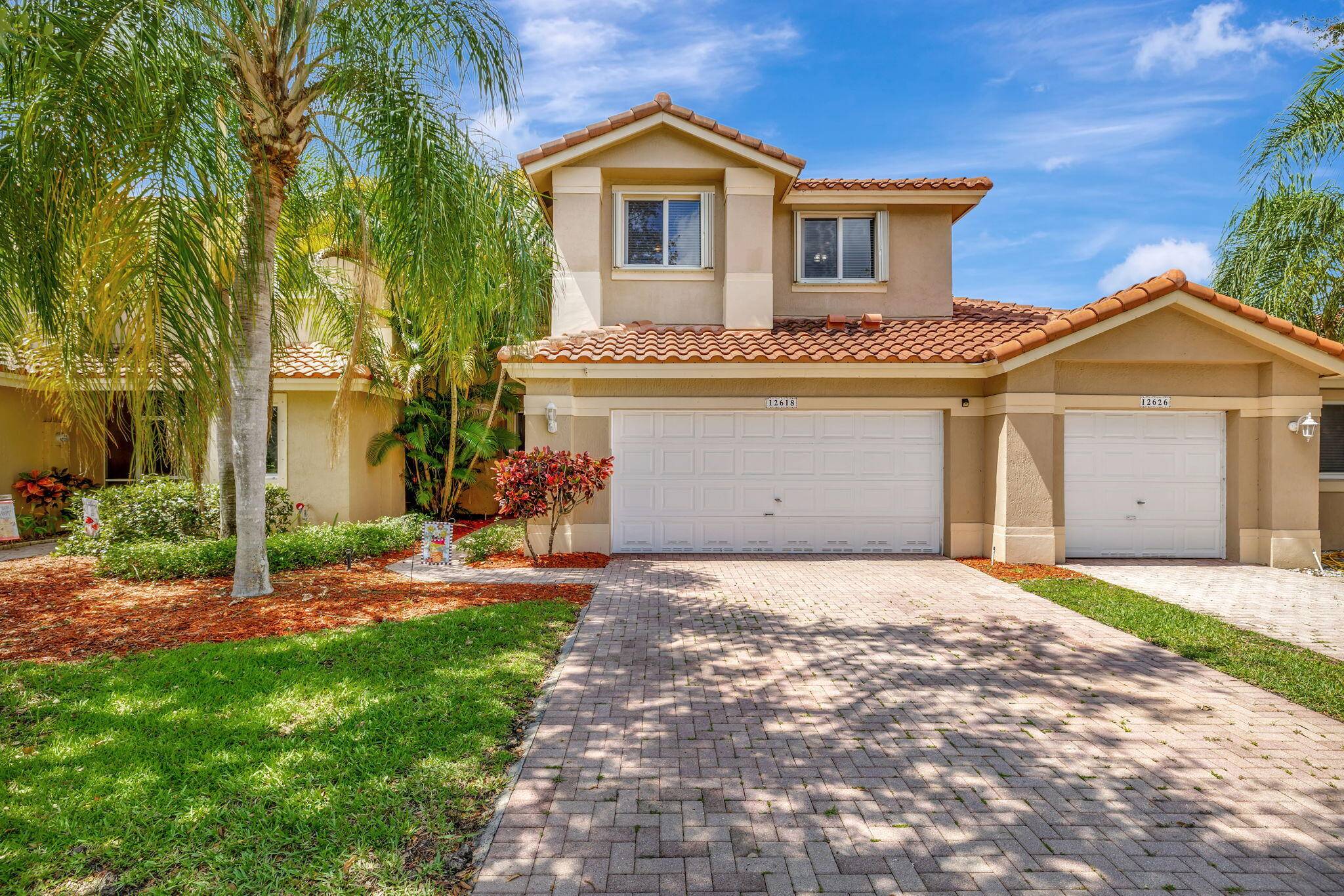 Charming Lakefront Townhome in Heron Bay, located in the desirable, gated community of Heron Bay.