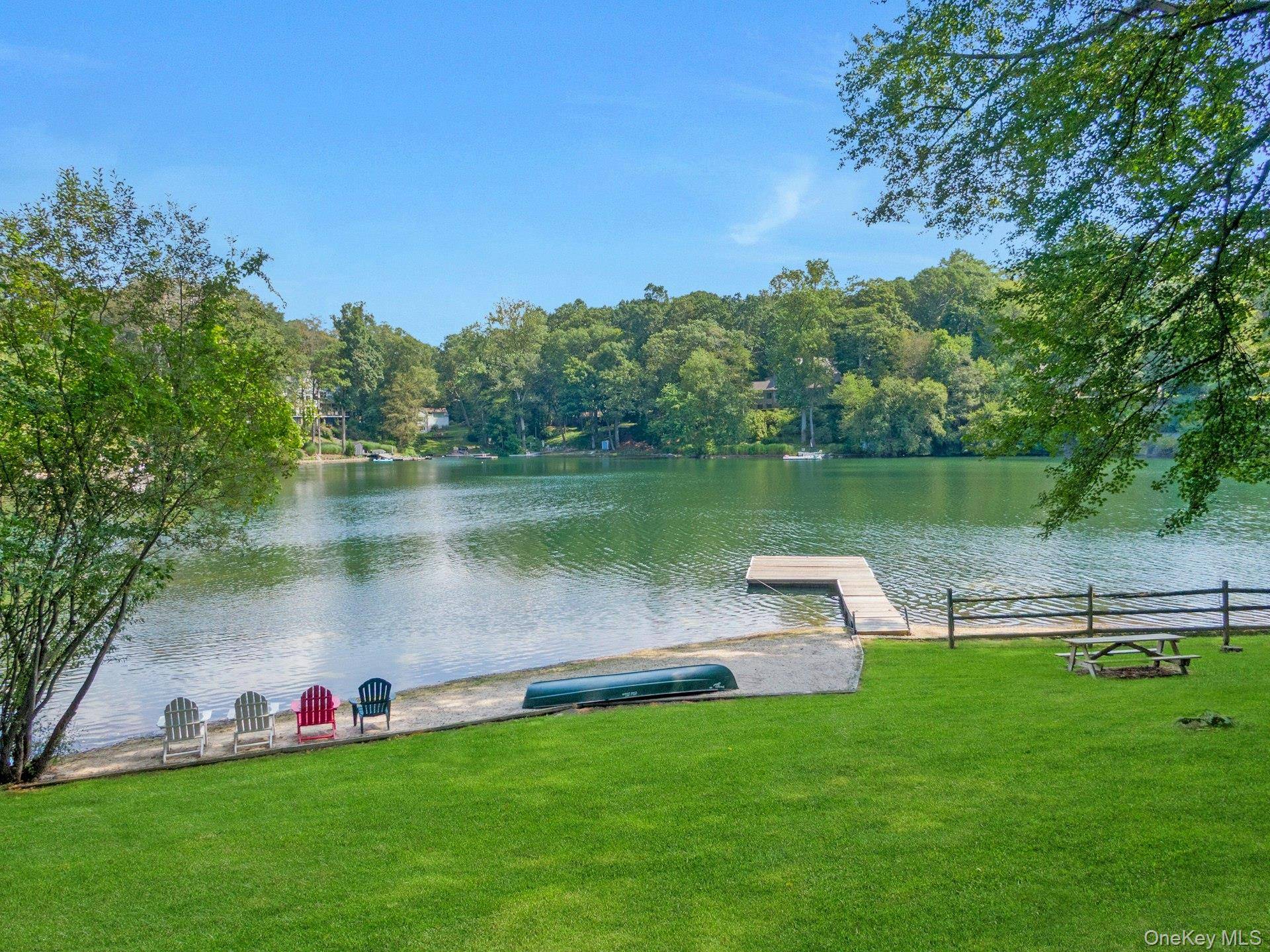 A dazzling opportunity to own an epic property in Armonk s coveted Windmill Farm community, privately set behind its own gate on 1.